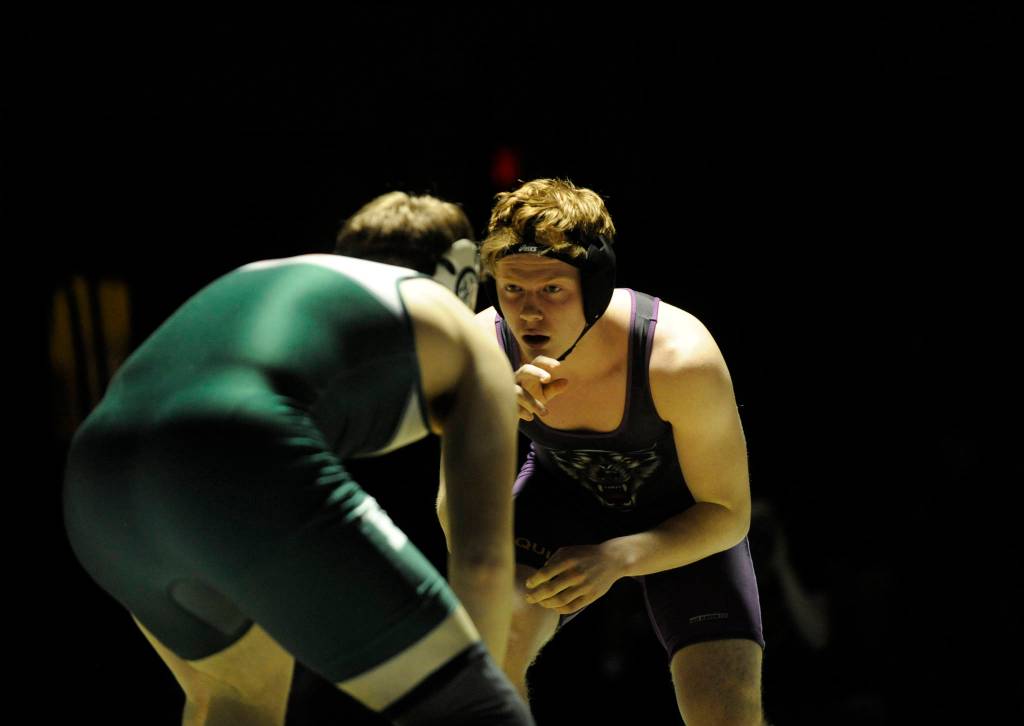 Sequims Logan Laxson grapples with Port Angeles Dom Timperio at 182 pounds on Jan. 17. Laxson conceded the match after an injury. Sequim Gazette photo by Michael Dashiell