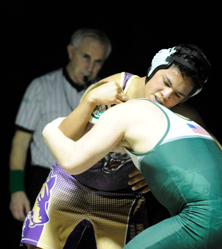 Sequims Kenneth Wolfley wrestles with Trevor Shumway at 182 pounds on Jan. 17. Sequim Gazette photo by Michael Dashiell