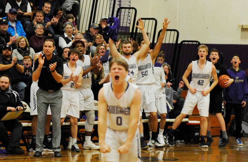Sequims bench erupts after the Wolves drew a charge in the first half of a 55-43 win over Bremerton last week. Sequim Gazette photo by Michael Dashiell