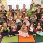 First-graders from Christine MacDougall-Danielsons class enjoy Oliver the Cat books, thanks a community education grant through Beta Nu Chapter of Delta Kappa Gamma. Submitted photo