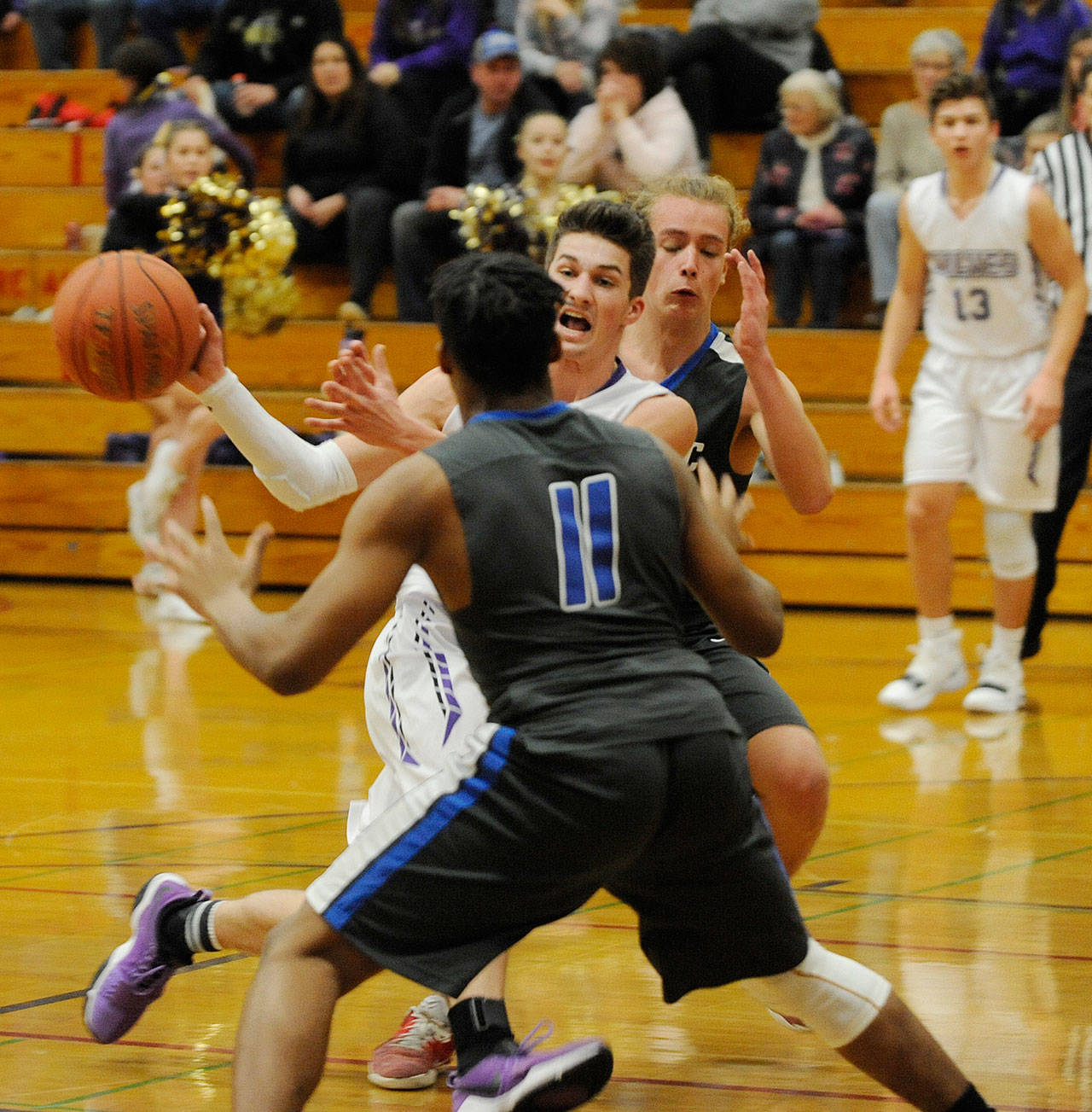 Prep basketball: Sequim boys clinch third seed, girls fall vs. Olympic