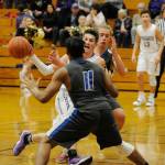 Prep basketball: Sequim boys clinch third seed, girls fall vs. Olympic