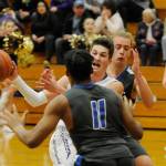 Prep basketball: Sequim boys clinch third seed, girls fall vs. Olympic