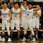 The Sequim bench erupts following Nate Despains three-point play to close the first half, one that gave the Wolves a 27-19 lead over rival Port Angeles. Pictured, from left, are Dallin Despain, Rigo Langston, Blake Wiker, Silas Lewis and Joey Oliver. Sequim Gazette photo by Michael Dashiell