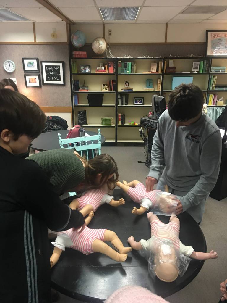 Olympic Peninsula Academy students practice CPR for infants. Submitted photo