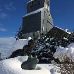 Snow covers the Sequim grain elevator on Sunday along with the statue Benjis Leap by Jay Wright. Sequim Gazette photo by Matthew Nash