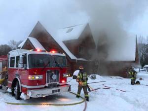 A chimney fire started late Tuesday afternoon on the 1800 block of West Washington Street in a log home. Fire officials with Clallam County Fire District 3 say the fire started on accident near the roof and chimney. Photo courtesy of Clallam County Fire District 3