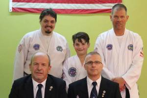 Three athletes from Bodystrong Academy earn black belts