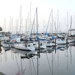 Boats sit on placid water at John Wayne Marina in Sequim. (Keith Thorpe/Peninsula Daily News)