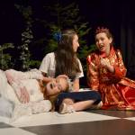 Alice (Kariya Johnson) converses with the Red Queen (Maggie van Dyken) just before the two queens (including White Queen Emily Bundy) opt to take a nap on her in Through the Looking-Glass. Sequim Gazette photo by Matthew Nash