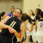 Sequims Hope Glasser and Abby Schroeder (11) share a hug after Sequims come-from-behind, 54-44 win at the 2A regoinal tournament against Foster on Feb. 22 in Auburn. Glasser led the team with 15 points. Sequim Gazette photo by Michael Dashiell