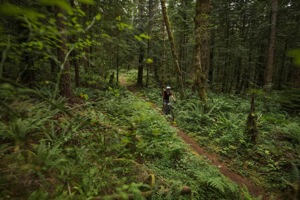 Powell Jones waves for the camera on a section of BC single track. Although much of the race was technical, there was still a lot of trail to sit back and enjoy without thinking to much about not crashing. Photo courtesy of Powell Jones
