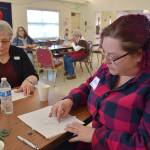 Lorraine Ford, back left, is an Olympic Peninsula Arts Association (OPAA) member and watercolor artist who invited Michelle Sparrow, front right, to attend OPAAs monthly member meeting. The two women practice sketching animals in an art demonstration by Carolyn Guske on Feb. 28. Sequim Gazette photo by Erin Hawkins