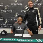 Sterling Penniston-John, left, signs a national letter of intent last week to play at Division I Utah Valley State University. The two-time Northwest Athletic Conference All-Star at Peninsula College is joined here by PC mens head coach Jake Hughes. Photo courtesy of Peninsula College