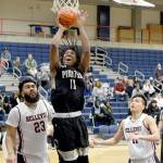Rick Ross Peninsulas Malik Moore grabs one of his 15 rebounds against Bellevue College as the Pirates won 69-68 to qualify for the NWAC Tournament.