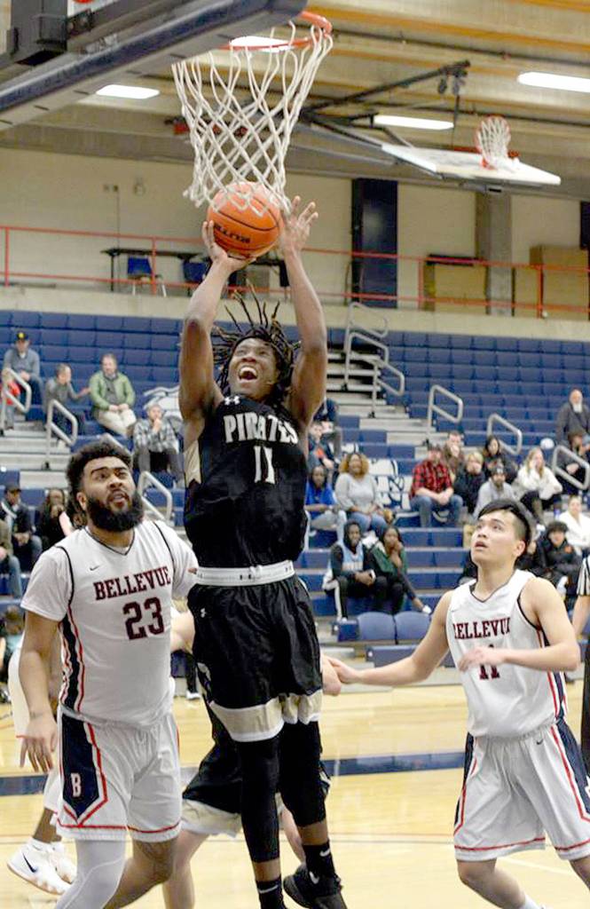 Rick Ross Peninsulas Malik Moore grabs one of his 15 rebounds against Bellevue College as the Pirates won 69-68 to qualify for the NWAC Tournament.