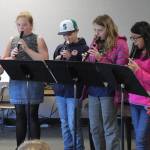 Greywolf Elementary students (from left) Calleigh Thompson, Jessie Bainbridge, Lincoln Bear, Kaesha Larsen and Alexandra Edgecomb perform music pieces on recorder for friends and school staff on Feb. 28. Photo by Donna Hudson