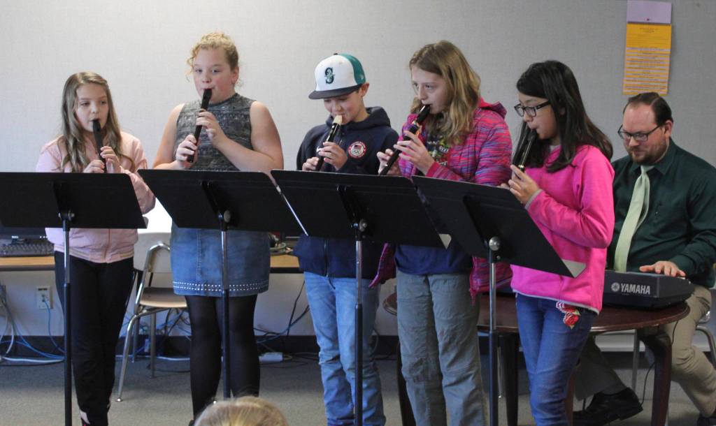 Greywolf Elementary students (from left) Calleigh Thompson, Jessie Bainbridge, Lincoln Bear, Kaesha Larsen and Alexandra Edgecomb perform music pieces on recorder for friends and school staff on Feb. 28. Photo by Donna Hudson