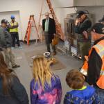 Construction officials, Sequim School District staff and school board members and their family tour the inside of the districts new central kitchen this week as its being readied for a tentative opening in early April to serve 900-plus meals daily. Sequim Gazette photo by Matthew Nash
