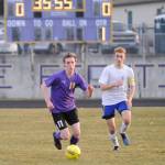 Sequims Ian Parker, left, pushes the ball upfield as Bremertons Evan Frankowski trails the play. Sequim Gazette photo by Michael Dashiell