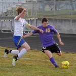 Sequims Mathys Tanche, right, looks to slip the ball past Bremerton defender Ian Stuart. Sequim Gazette photo by Michael Dashiell