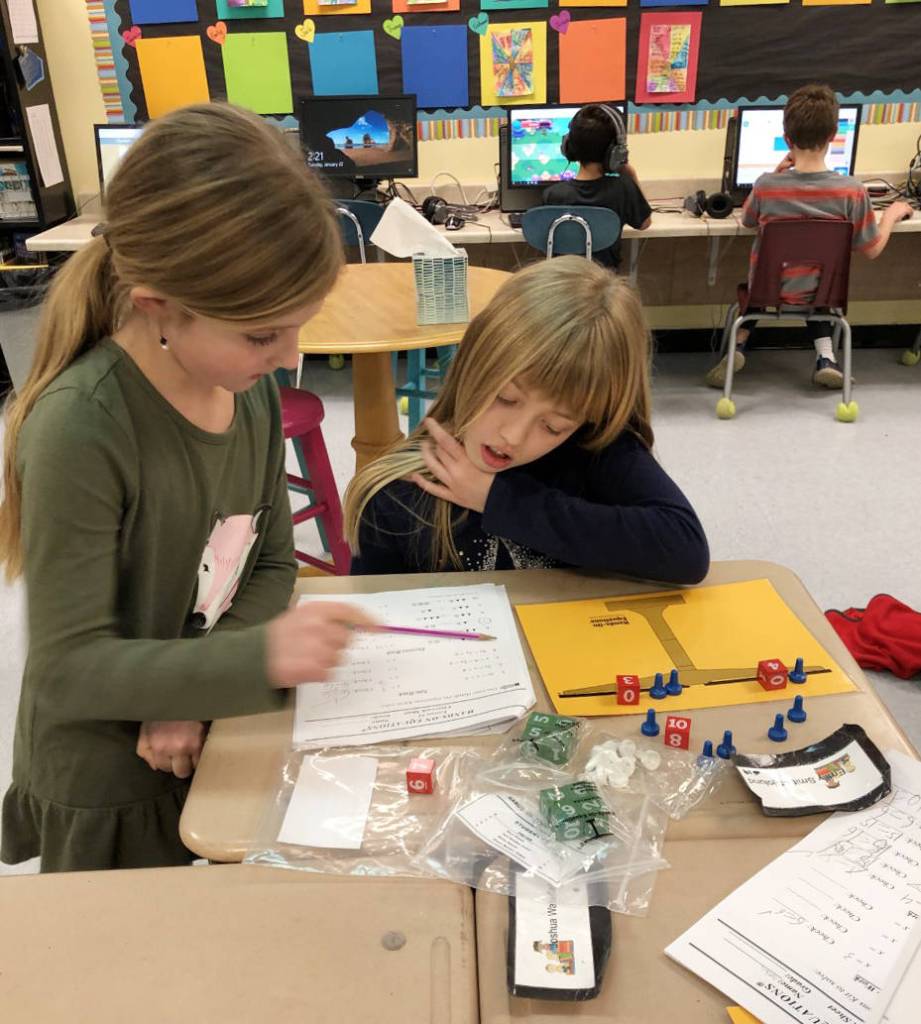 Gracie Huntsman, left, and Emily Smith-Sjolund, students in Emily Ellefsons third-grade class at Helen Haller Elementary, work on an algebra unit. Submitted photo