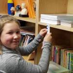 Harper Moore, a fourth-grade student at Helen Haller Elementary, practices using fractions. Submitted photo