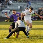 Sequim exchange student Mathys Tanche, left, vies for the ball with North Kitsap keeper Zach Coleman in the first half of the Wolves 6-0 win over the Vikings on March 20. Sequim Gazette photo by Michael Dashiell