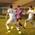 Sequim sophomore Eli Gish, center, looks to get past the North Kitsap defense in the first half of a March 20 Olympic League match-up in Sequim. Sequims Wolves won, 6-0. Sequim Gazette photo by Michael Dashiell