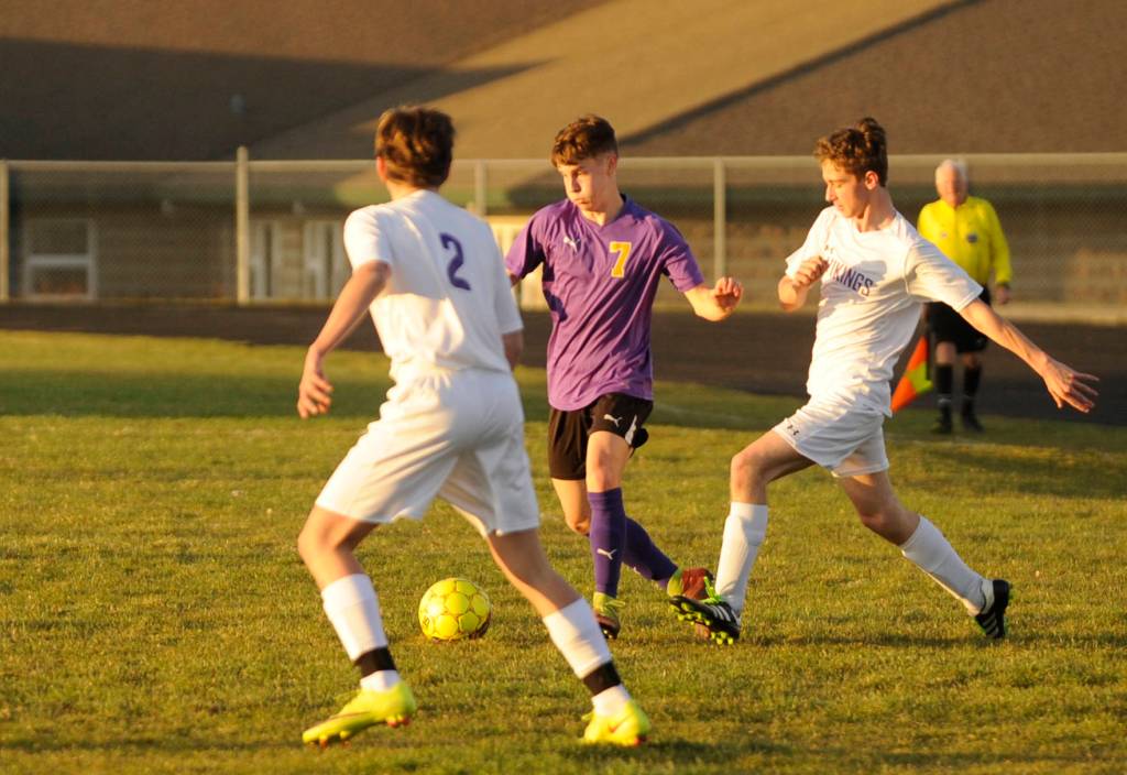 Sequim sophomore Eli Gish, center, looks to get past the North Kitsap defense in the first half of a March 20 Olympic League match-up in Sequim. Sequims Wolves won, 6-0. Sequim Gazette photo by Michael Dashiell