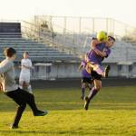 Sequims Mathys Tanche, right, looks to avoid contact as North Kitsap keeper Zach Coleman clears the ball in the first half of the Wolves 6-0 win over the Vikings on March 20. Sequim Gazette photo by Michael Dashiell