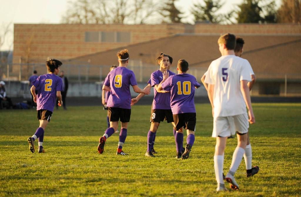 Sequims Ryan Tolberd, center, celebrates a first half goal with teammates Adrian Funston (9) and Mathys Tanche (10), as Sequim routs North Kitsap 6-0 on March 20. Sequim Gazette photo by Michael Dashiell