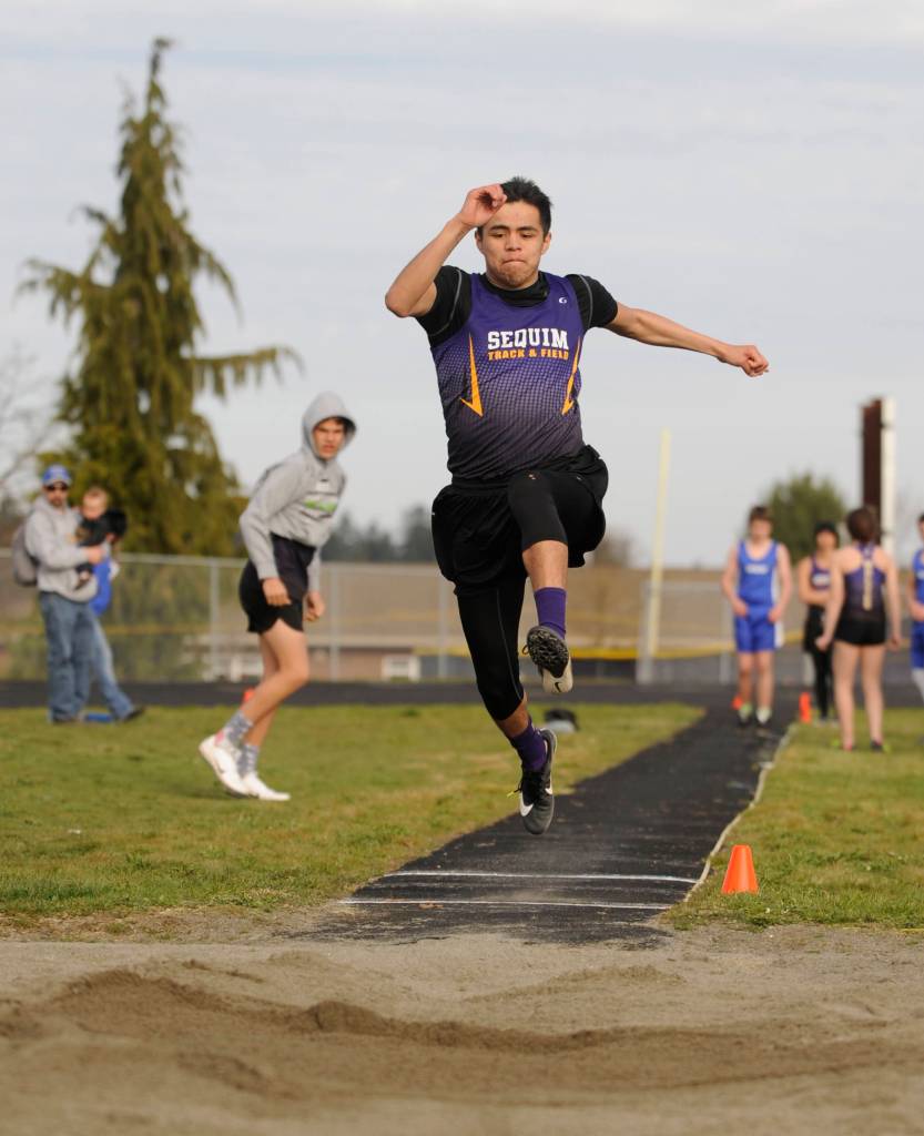 Sequims Rigo Langston competes in the long jump on March 21. Langstons 15-foot 7-inch effort placed the senior fifth. Sequim Gazette photo by Michael Dashiell