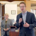 U.S. Rep. Derek Kilmer, D-Gig Harbor, speaks at a presentation about the community importance of William R. Fairchild International Airport in Port Angeles as Port of Port Angeles Commissioner Connie Beauvais listens. (Keith Thorpe/Peninsula Daily News)