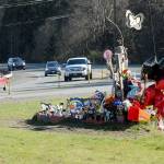 Traffic last week passes a roadside memorial to Brooke Bedinger, who died in a motorcycle wreck on U.S. Highway 101 at Morse Creek near Port Angeles on June 21. The state House has proposed funding for a barrier but the state Senate budget does not include the $2.5 million project. Photo by Keith Thorpe/Peninsula Daily News