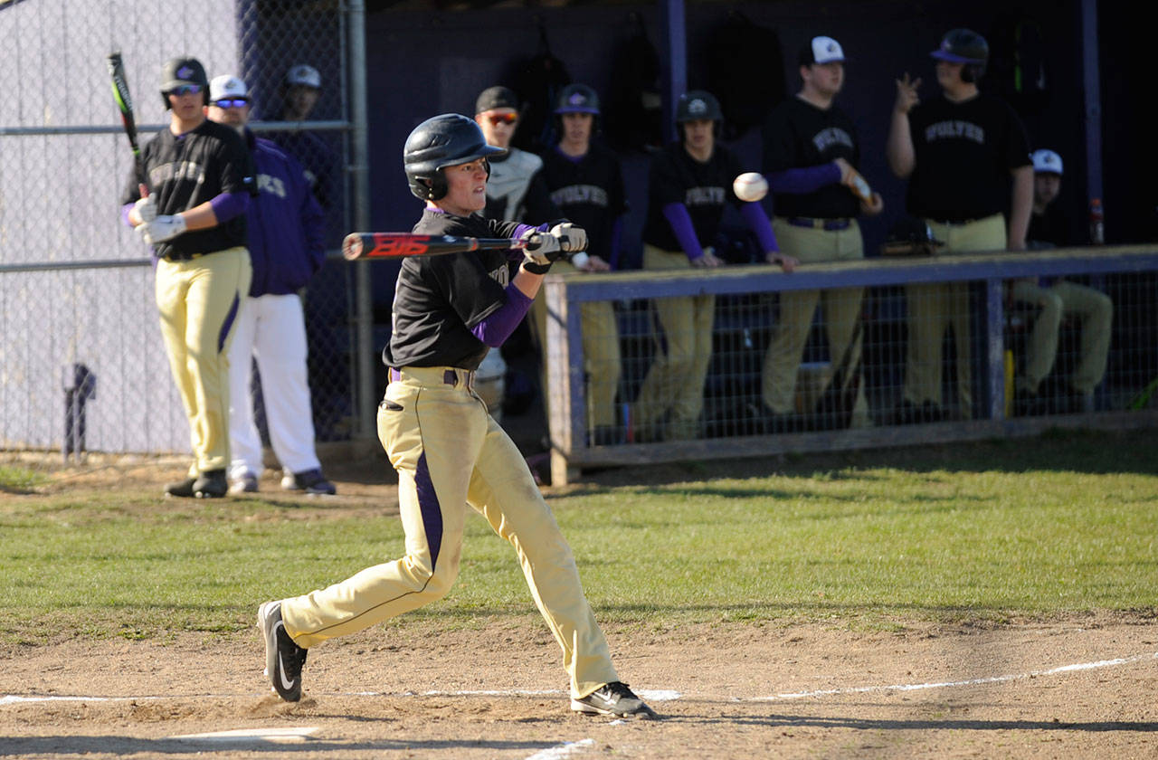 Sequims Joey Oliver rips a base hit off Crosspoint starter Gage Broderson in the first inning in the Wolves 11-1 win on March 26. Oliver was 2-for-3 with an RBI and two runs scored. Sequim Gazette photo by Michael Dashiell