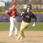 Sequims Michel Young rounds third on his way to score one of the Wolves 11 runs in a rout of Crosspoint on March 26. Young scored three times in the non-league win. Sequim Gazette photo by Michael Dashiell