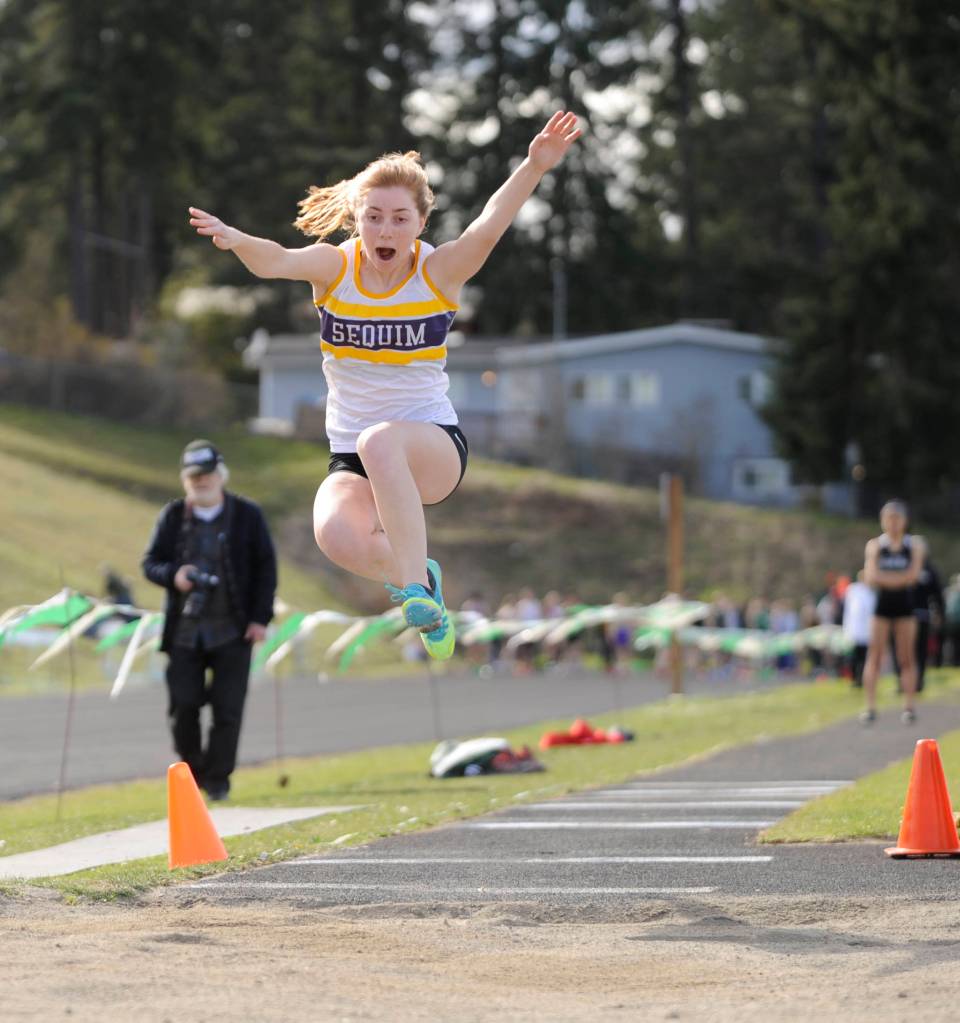 With a 14-2 mark  a personal best  Sequims Daisy Ryan places fifth in the long jump at the March 28 Flying A track meet in Port Angeles. Sequim Gazette photo by Michael Dashiell
