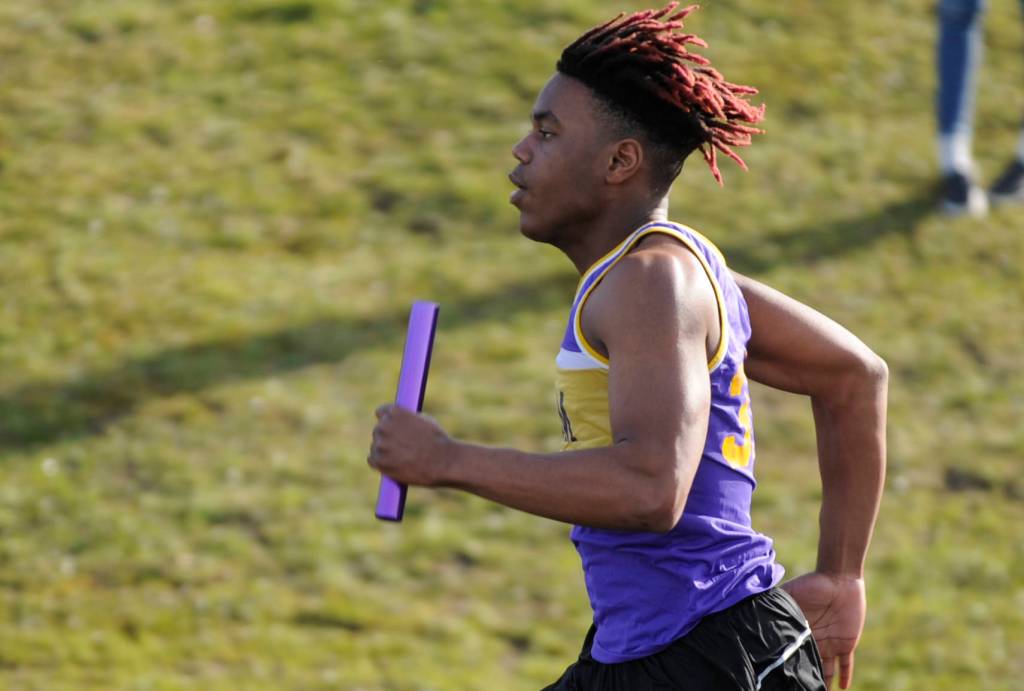 Sequims Keeshawn Whitney anchors the Wolves 4x100 relay leg at the Flying A track meet in Port Angeles on March 28. Sequims team of Whitney, Logan Laxson, Jarrett Allen and Darren Salazar won the event in 44.65 seconds. Sequim Gazette photo by Michael Dashiell