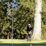 Sequims Blake Wiker lines up a putt in the Wolves March 26 win over Kingston at The Cedars at Dungeness. Sequim Gazette photo by Michael Dashiell