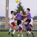 Sequims Eli Gish, center, and Sean Weber, right, look to get a head on the ball in the Wolves 4-2 home victory over Kingston on March 28. Sequim Gazette photo by Michael Dashiell