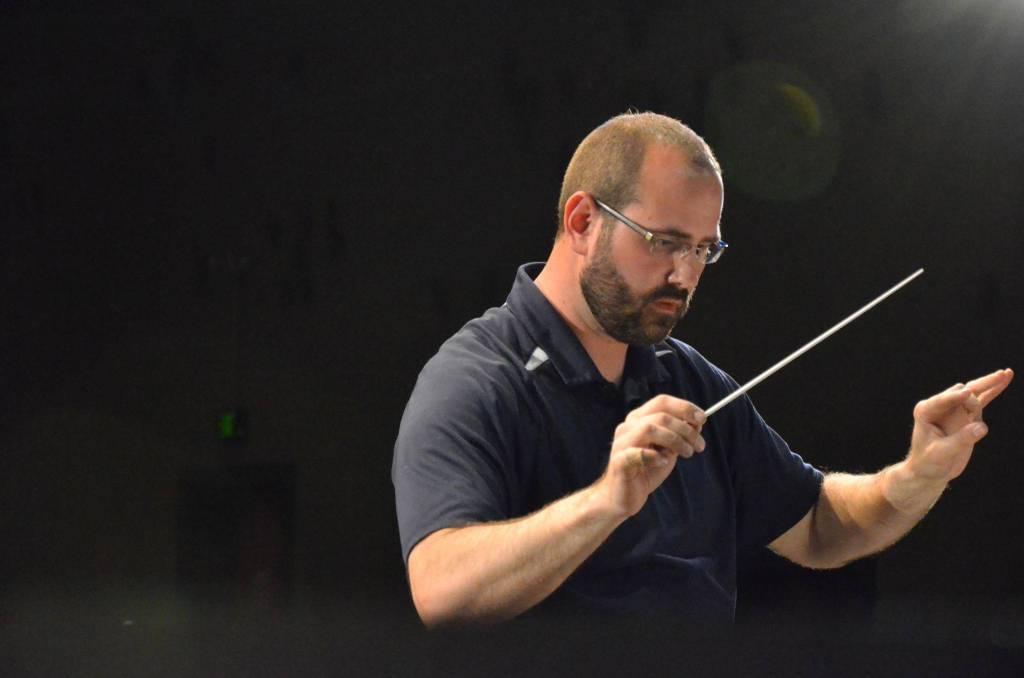 Sequim City Bands Tyler Benedict conducts a during dress rehearsal for a May 2014 concert. Photo courtesy of Sequim City Band