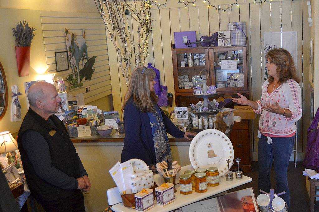 Vickie Oen, general manager of Purple Haze Lavender Shop, speaks to Sequim Mayor Dennis Smith and U.S. Small Business Administration Seattle District Director Kerrie Hurd about the growth of the farm and what led to the start of the shop. Smith and Hurd were part of a walking tour on March 28 to meet-and-greet with small businesses to hear concerns and share possible resources. Sequim Gazette photo by Matthew Nash