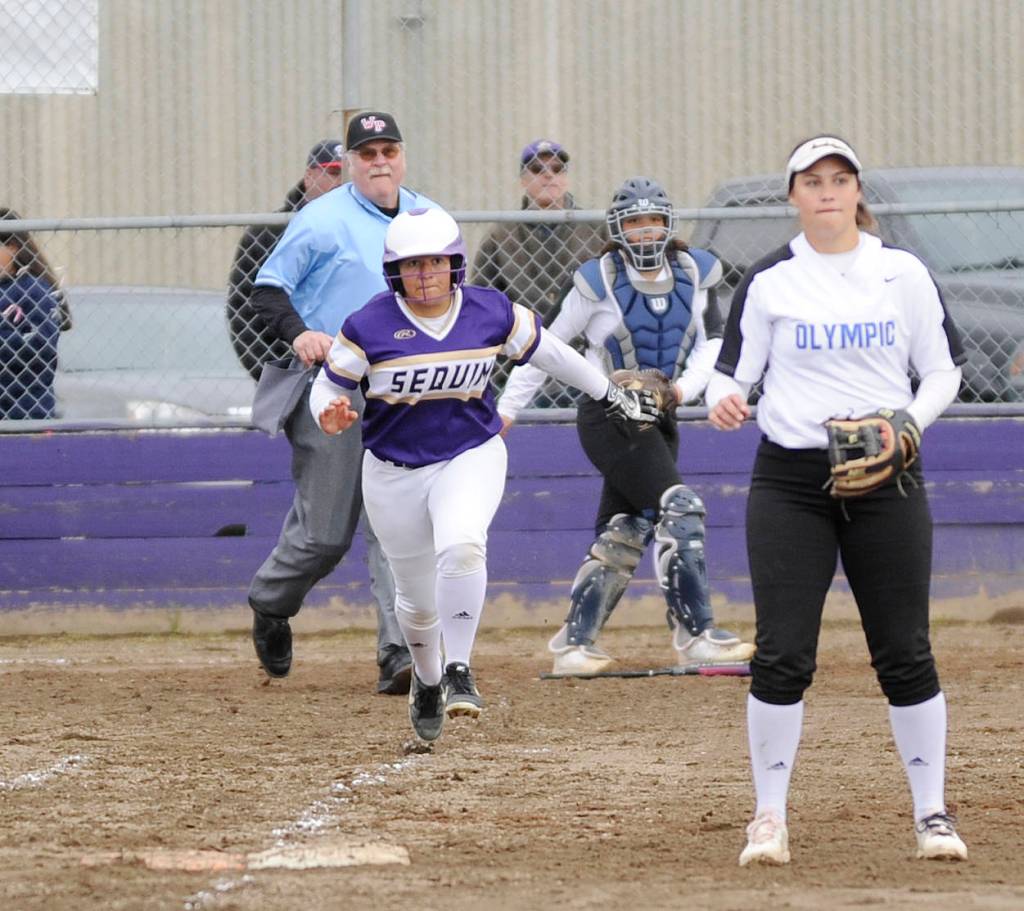 Fastpitch: Trojans rally late, edge Wolves