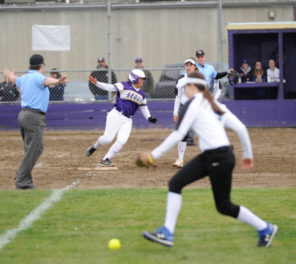 Fastpitch: Trojans rally late, edge Wolves