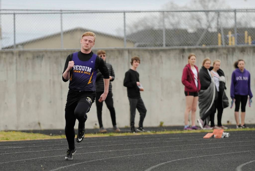 Sequims Logan Laxson breaks from the starting line to place first in the 400-meter race in Sequim on April 11. Sequim Gazette photo by Michael Dashiell