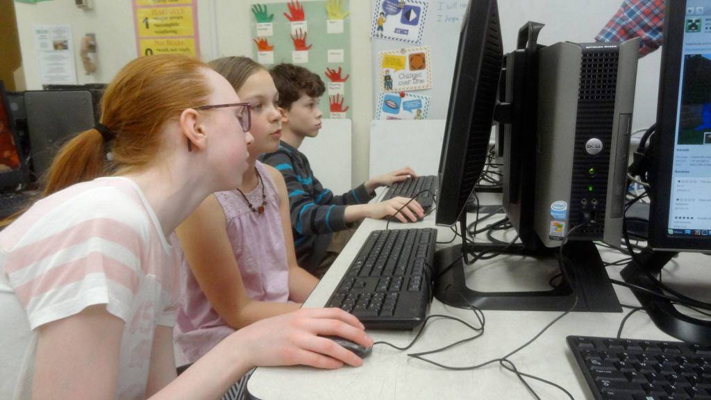 Computer Club members, from left, Grace Burkhardt, Ella Garcelon, and Jackson Krause surf programs during Sequim PC Users Groups five-week session at Roosevelt Elementary in Port Angeles. Its the second time the club has met this school year, and organizers plan to host it again next fall. Photo courtesy of Dick Wolf