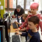 Sherri Smith with the Sequim PC Users club helps students work on computers at Roosevelt Elementarys second session of Computer Club, including from front to back, Jacob Burkhardt, Aiden Johnson, a student helper, Kairi Latson and Madison Feller. Photos courtesy of Dick Wolf