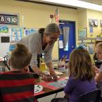 Helen Haller Elementary kindergartners in Stephanie Grotzke-Nashs class listen in for advice from Carrie Rodlend about how best to paint a sheep. When shes not teaching art in classrooms, Rodlend works with children and adults in Dungeness making art. Her latest show on April 20 at 562 Holgerson Road focuses on land- and seascapes. Sequim Gazette photo by Matthew Nash