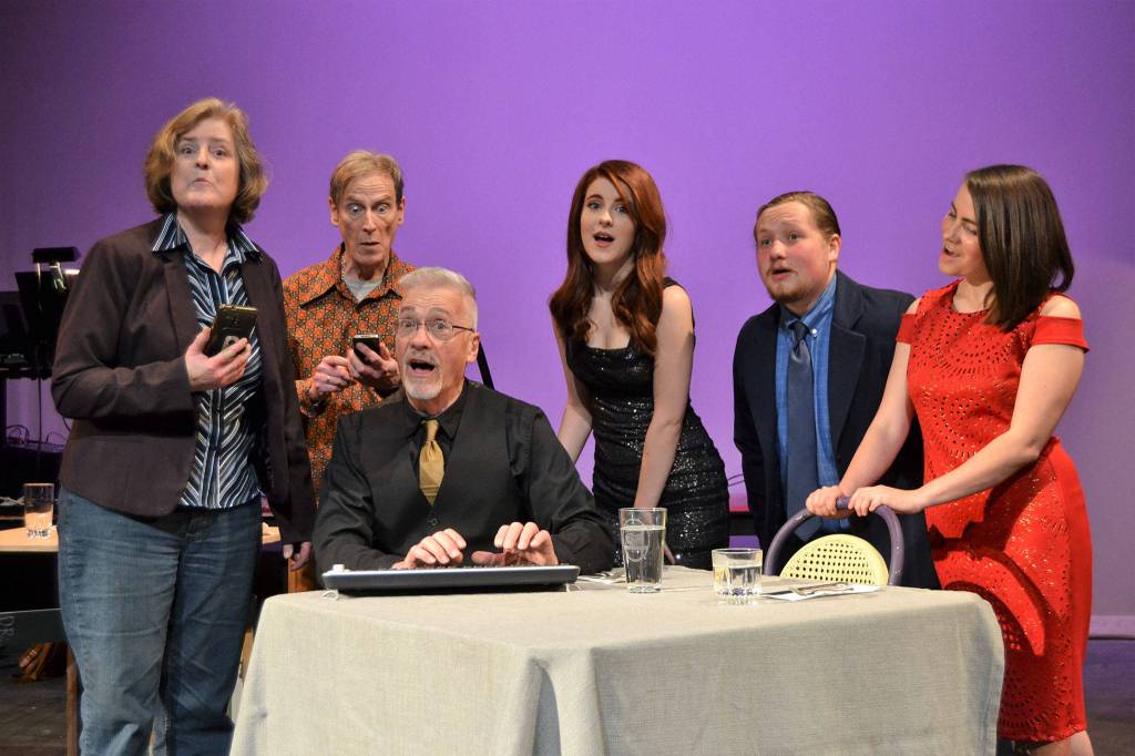 The cast of First Date, from left, Victoria Miller, Dan DePrez, Greg Scherer, Alison Cobb, Austin Krieg, and Emma Jane Garcia warn viewers about having an online presence while dating in the musical number The World Wide Web Is Forever. Sequim Gazette photo by Matthew Nash